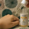person applying vitawave serum on the hand